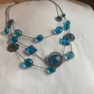 Beaded necklace with dark colored chain